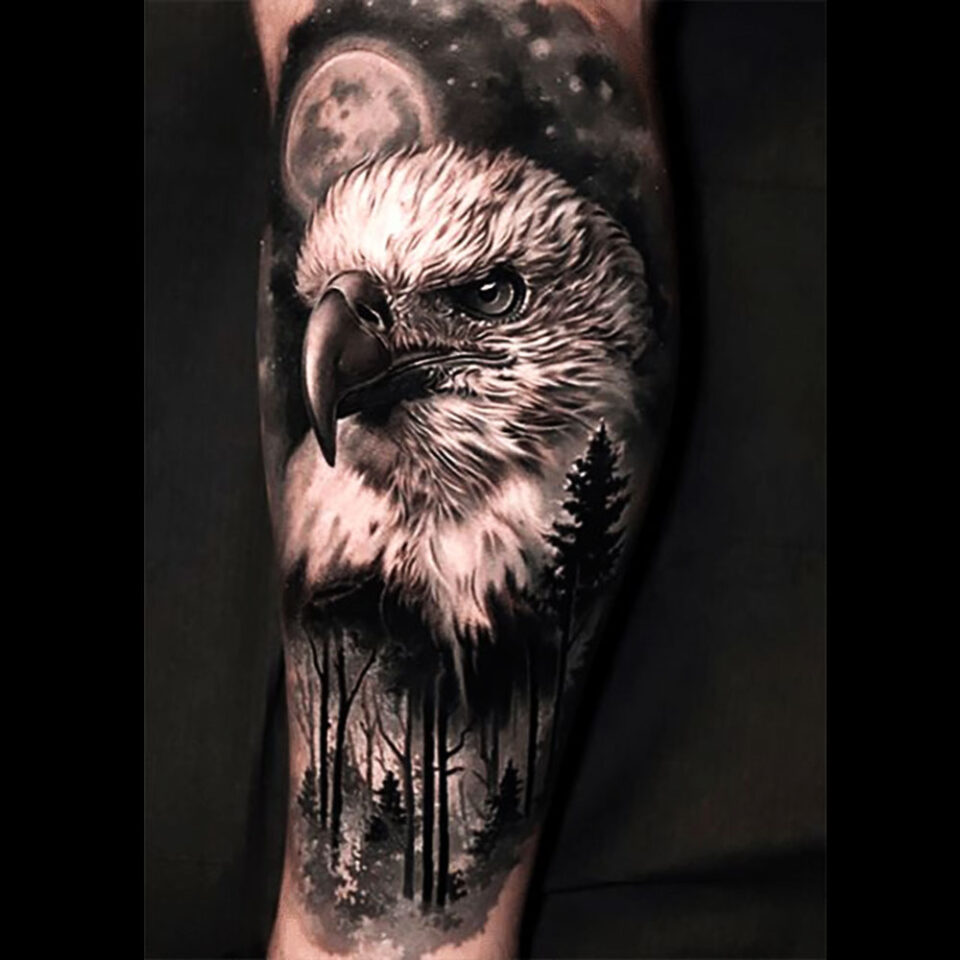 Eagle tattoo with a landscape background