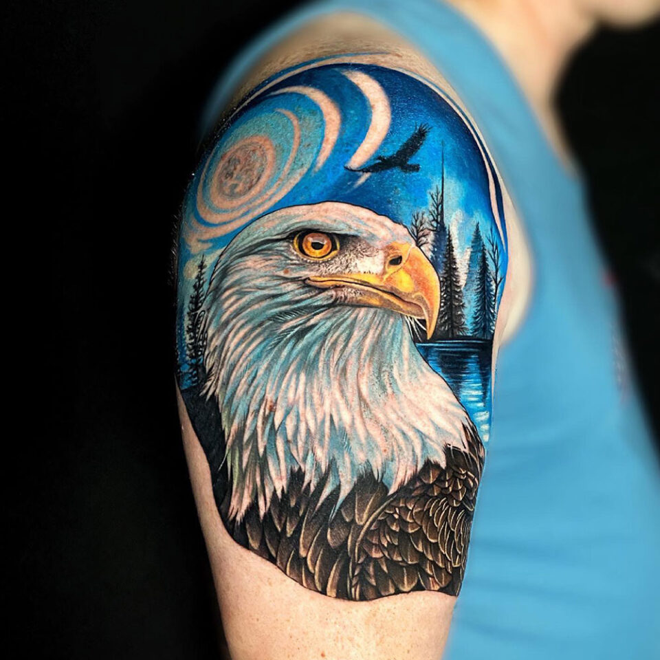 Eagle tattoo with a space theme Source @bigcattattoos via Instagram