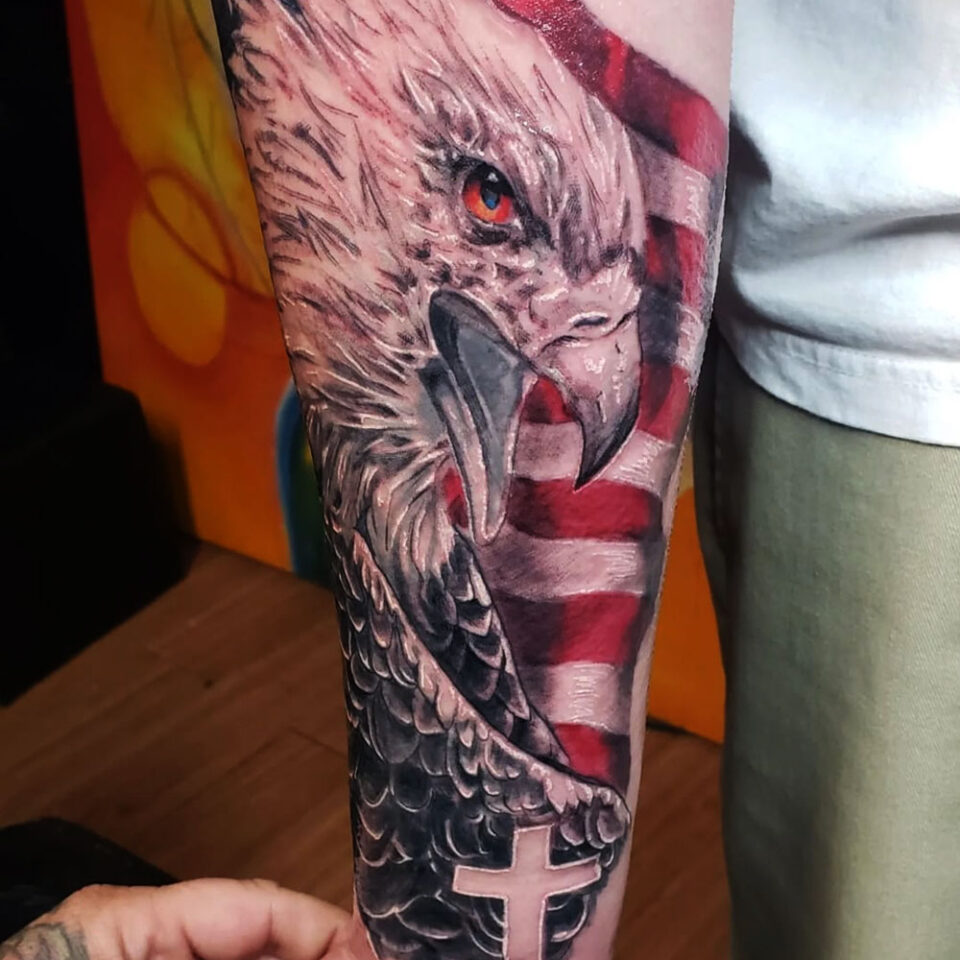 Eagle with a Cross Tattoo Source @habitattoo805 via Instagram