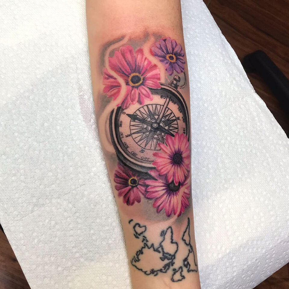 Floral compass tattoo sourced via IG @mister_placasos_tattoo_shop