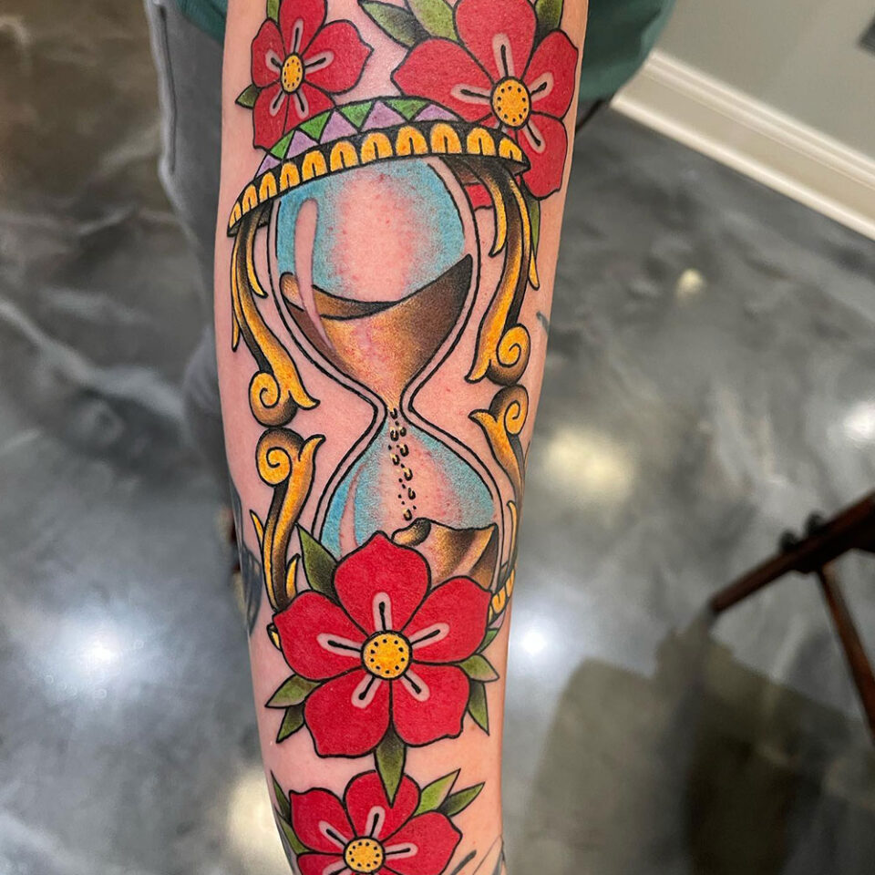Floral hourglass tattoo sourced via IG @ryanwhitsontattoo