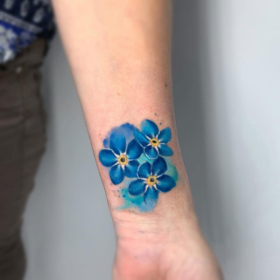 Forget-me-not floral tattoo sourced via IG @paintingisntdead