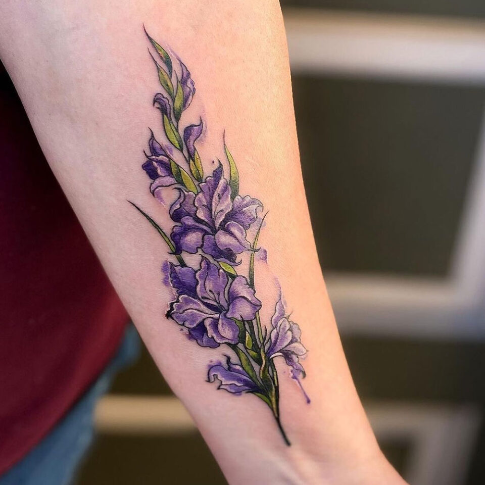 Gladiolus floral tattoo sourced via IG @female_tattoo_artists