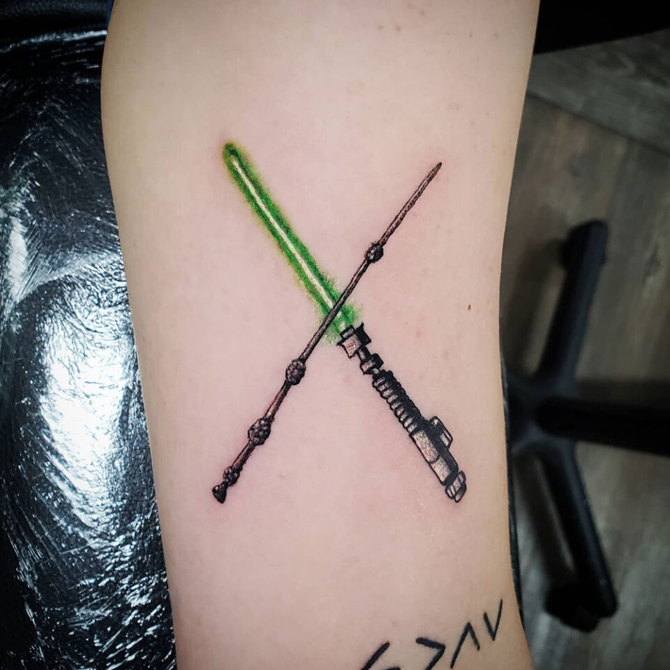 Glowing lightsaber and Jedi tattoo Source @kenzie_redelman via Instagram