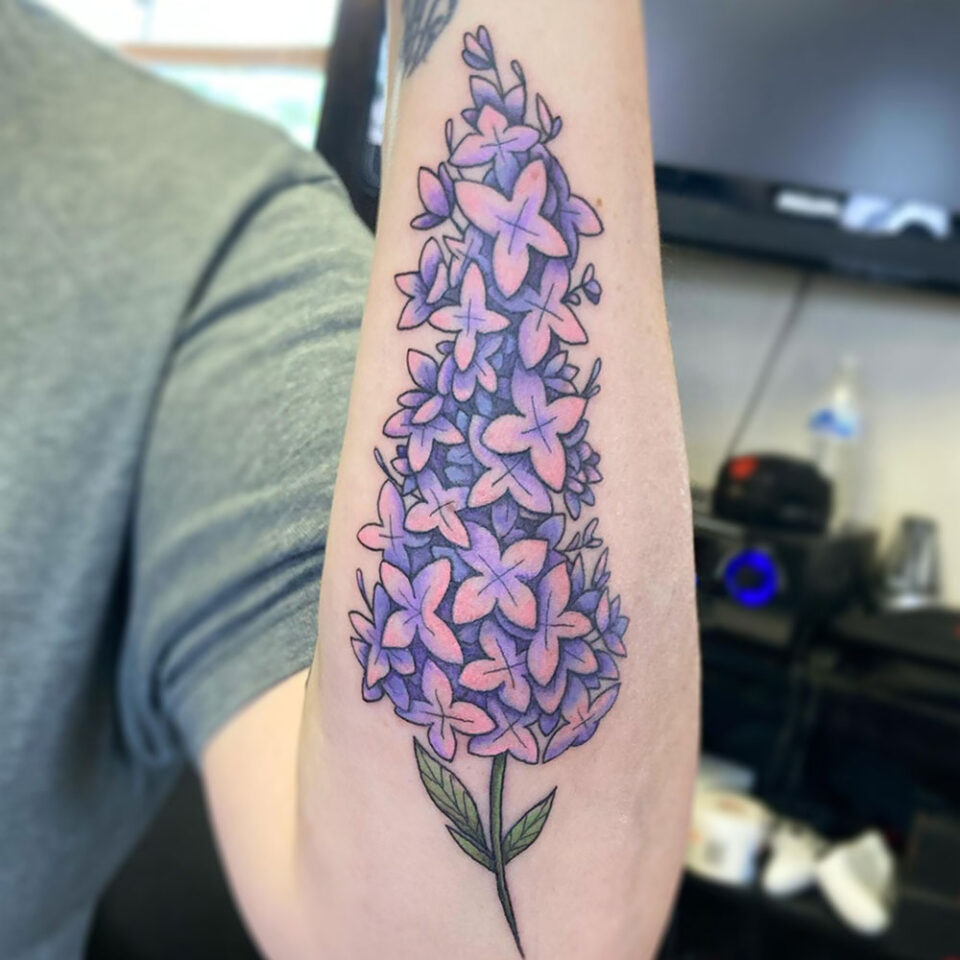Lilac floral tattoo sourced via Twitter @InkwellTattoos2