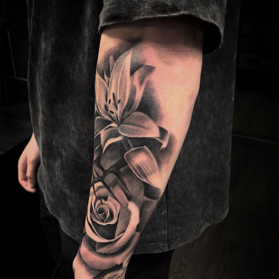 Lily floral tattoo sourced via IG@afinetattooestablishment