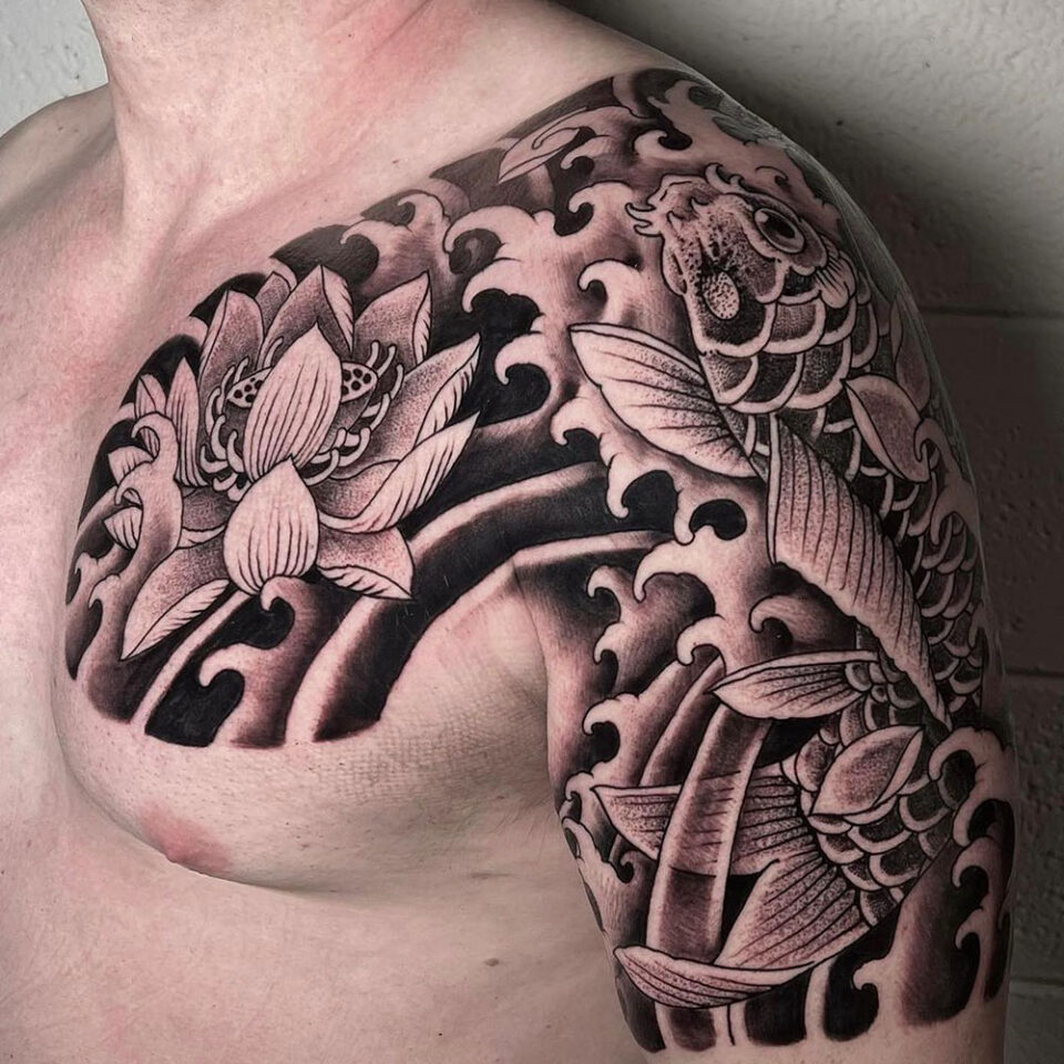 Lotus and Koi floral tattoo sourced via IG @fountainsquaretattoo