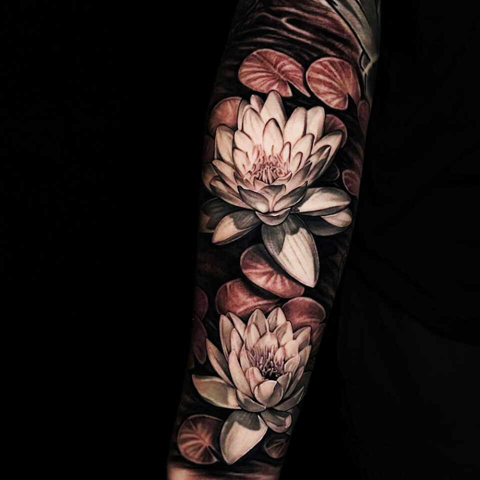 Lotus floral tattoo sourced via IG @dylan_jonze