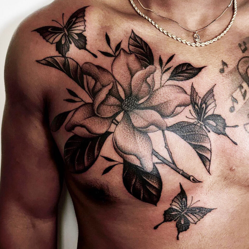Magnolia floral tattoo sourced via IG @justinoliviertattoo