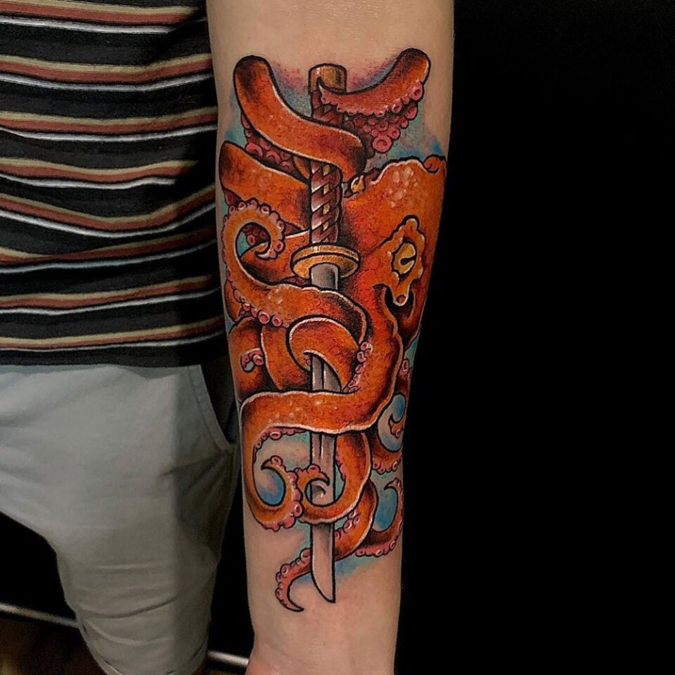 Mythical creature sword tattoo Source @slipperyjacktattoos via Instagram