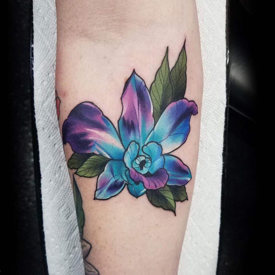 Orchid floral tattoo sourced via IG @_frog_god