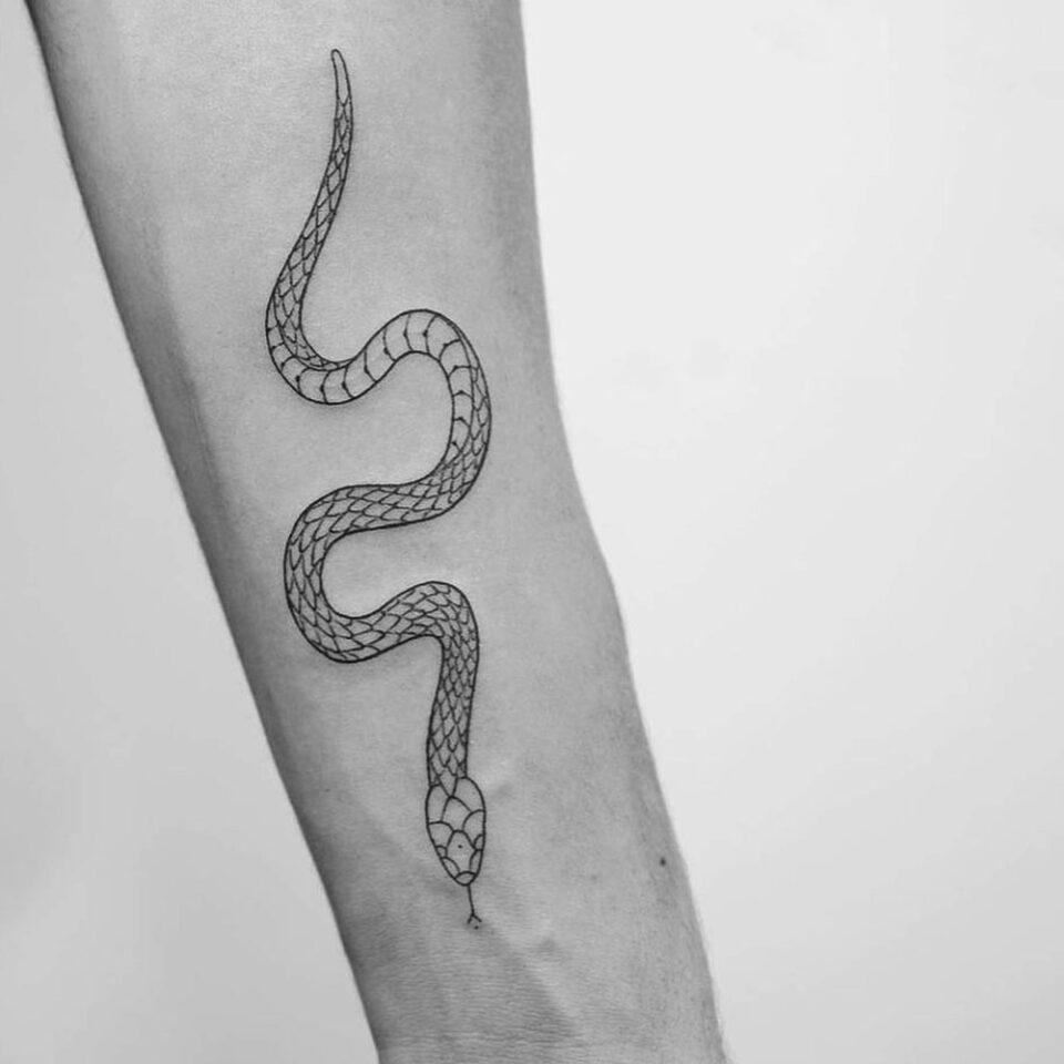 Serpent Single Line Tattoo Source @derekcastro13 via Instagram