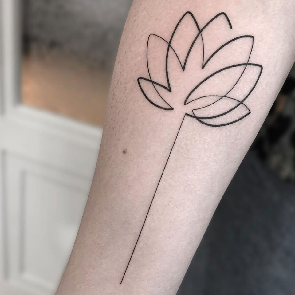 Simple Lotus Single Line Tattoo Source @miyo.tattoo via Instagram