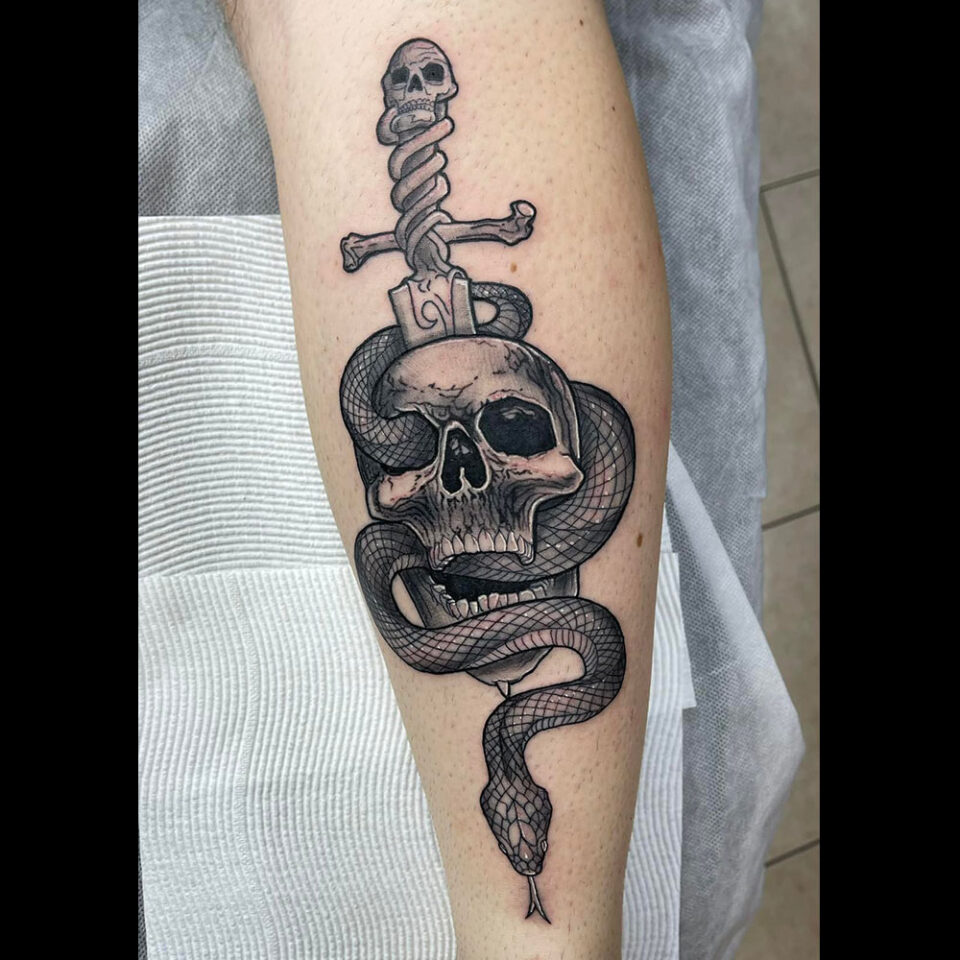 Skull sword tattoo Source @gothic_realm_tattoo_and_barber via Instagram