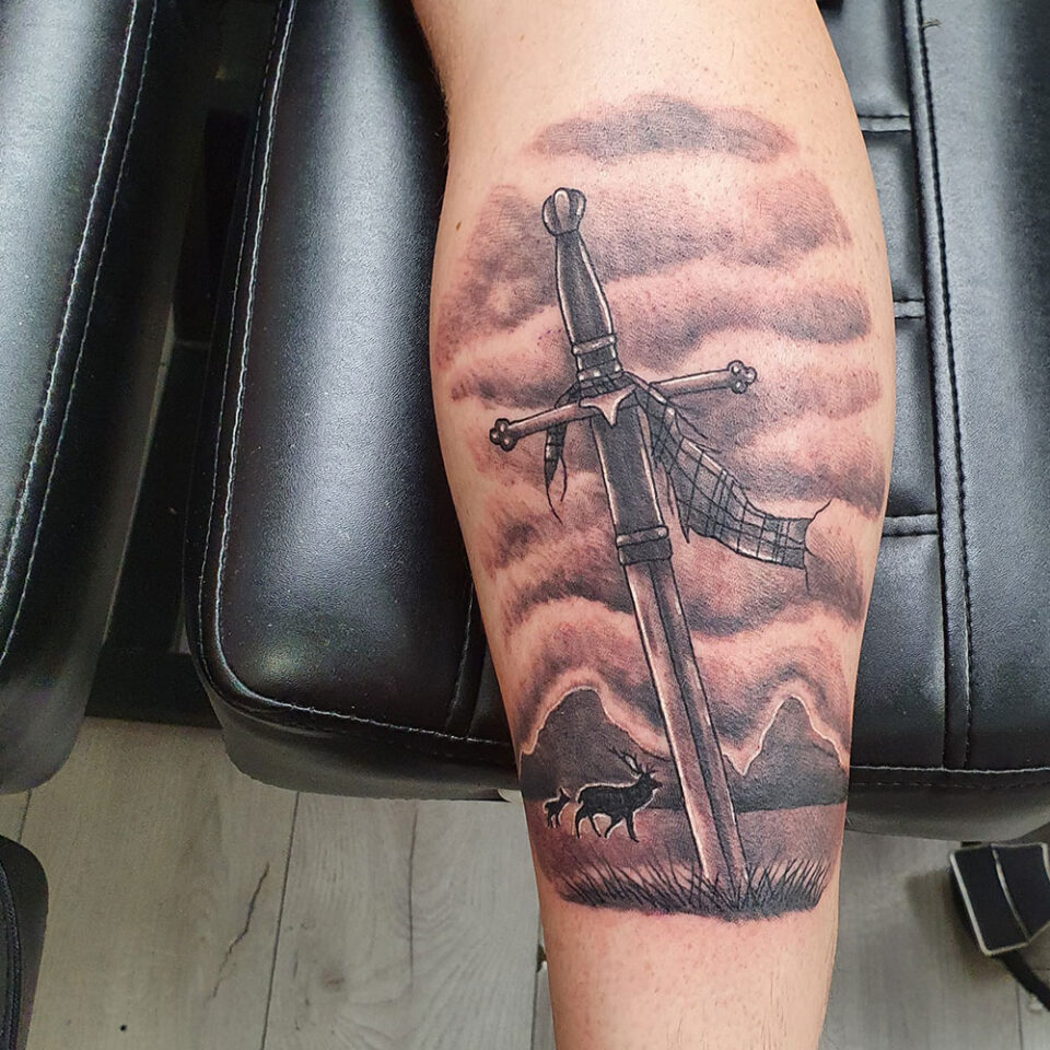 Sword and Mountain Tattoo Source @linkdtattoo via Instagram