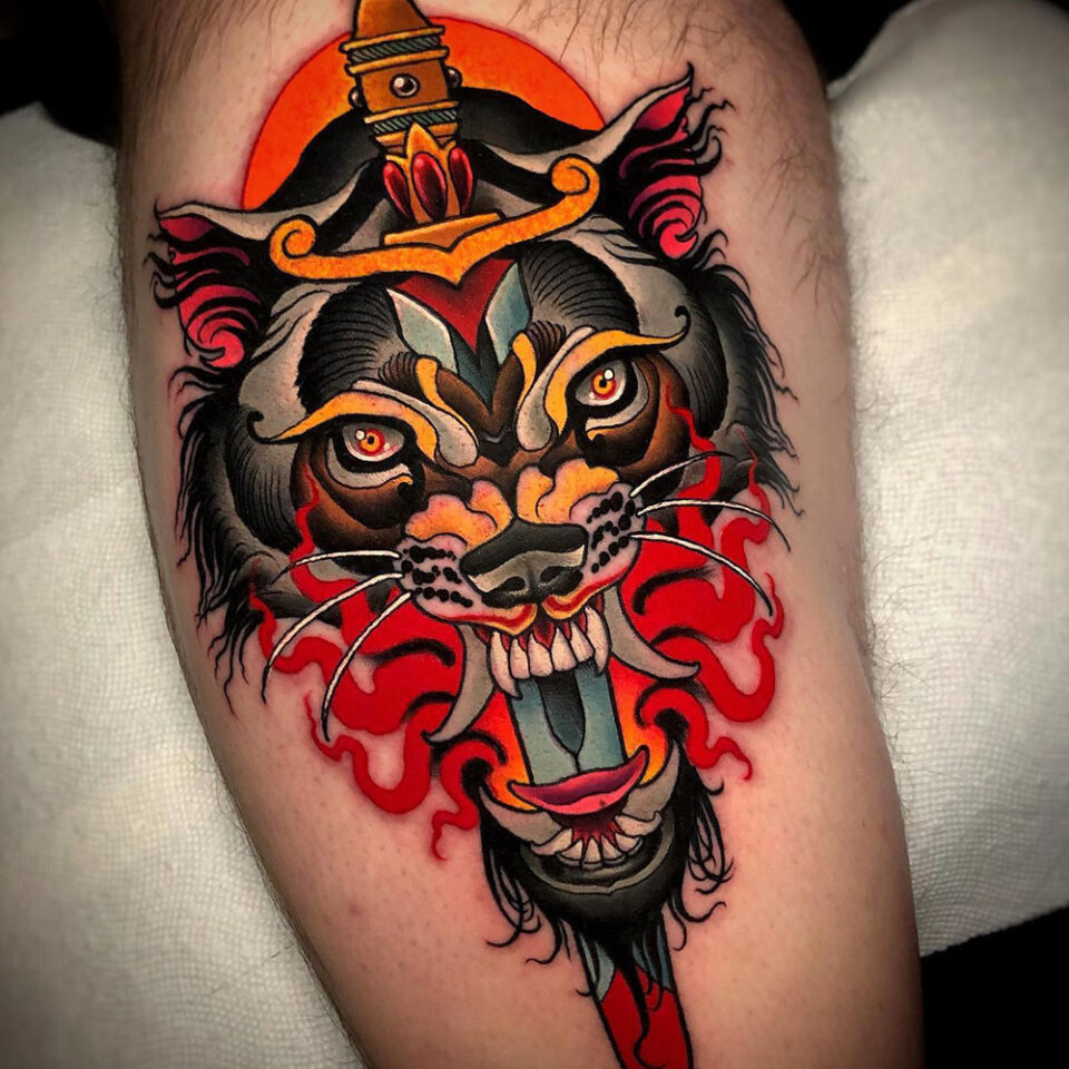 Sword and Wolf Tattoo Source @jeffsaunderstattoo via Instagram