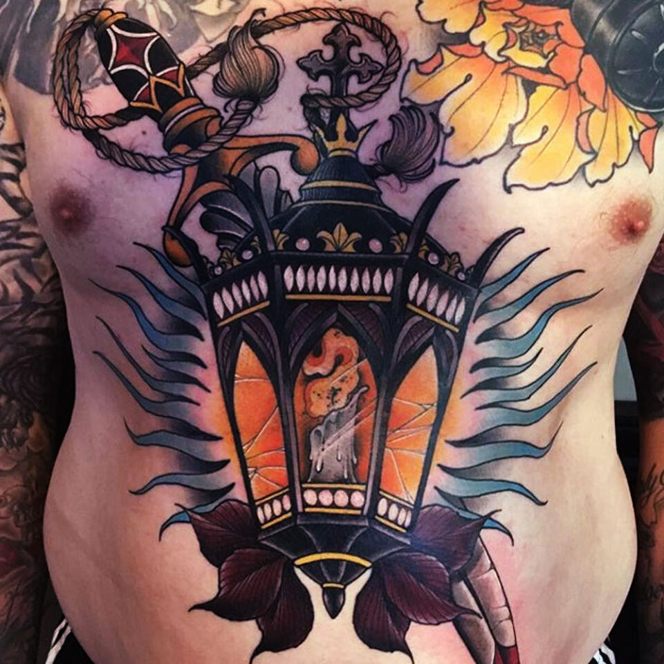 Sword and lantern tattoo Source @br.thomastattoo via Instagram