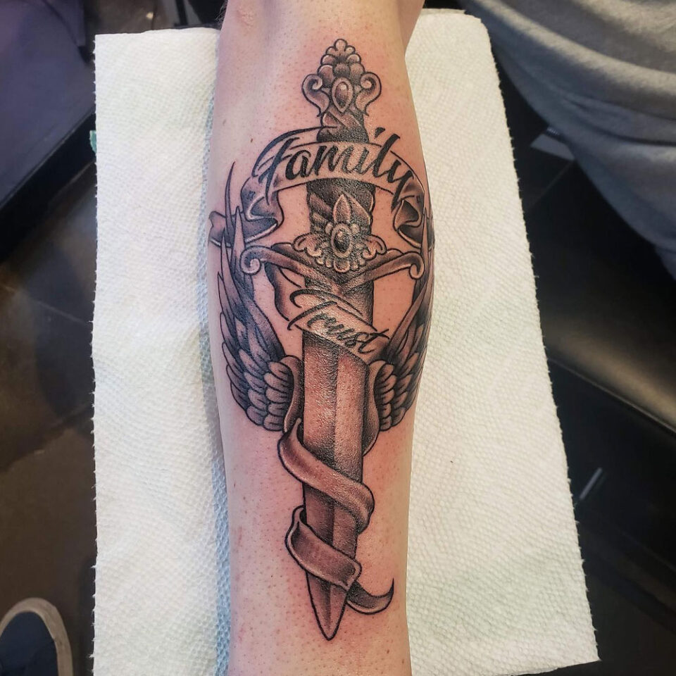 Sword and ribbon tattoo Source @adrenalinemontreal via Instagram