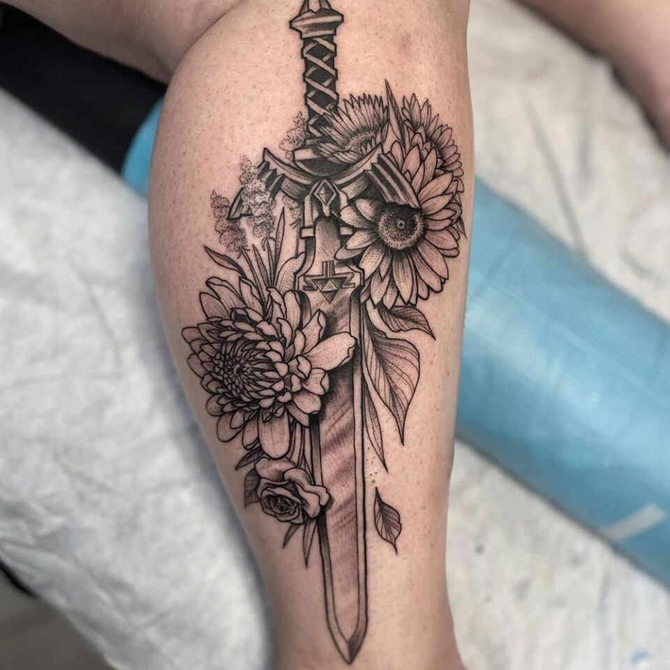 Sword with Flowers Tattoo Source @thequillian via Instagram