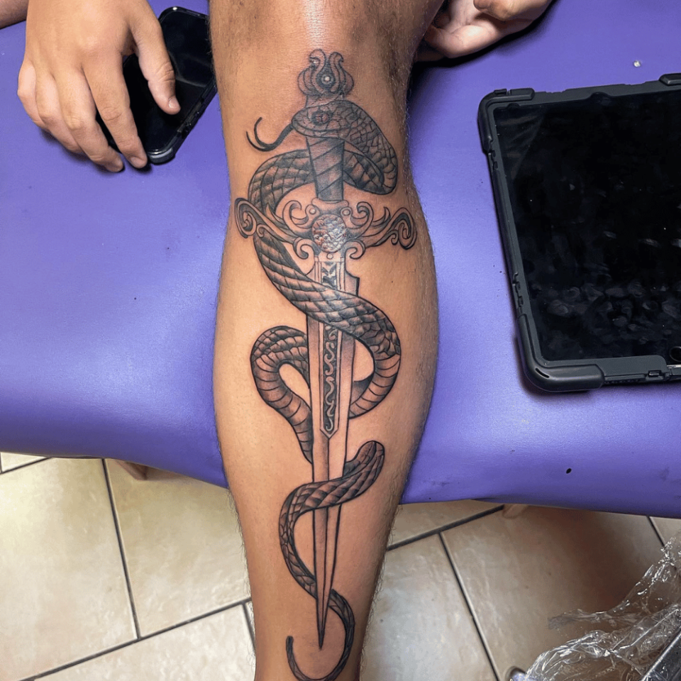 Sword with Snake Tattoo Source @tattoosdelgordo via Instagram