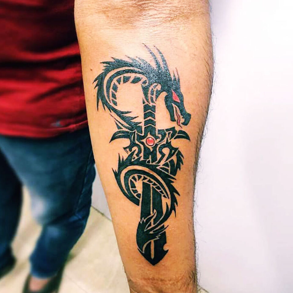 Tribal sword tattoo Source @xtreme_tattoo_studio via Instagram