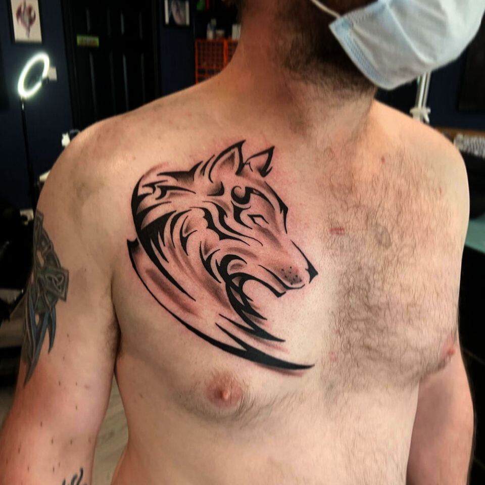 Tribal wolf Tattoo Source @inkredible_inks_kells via Instagram