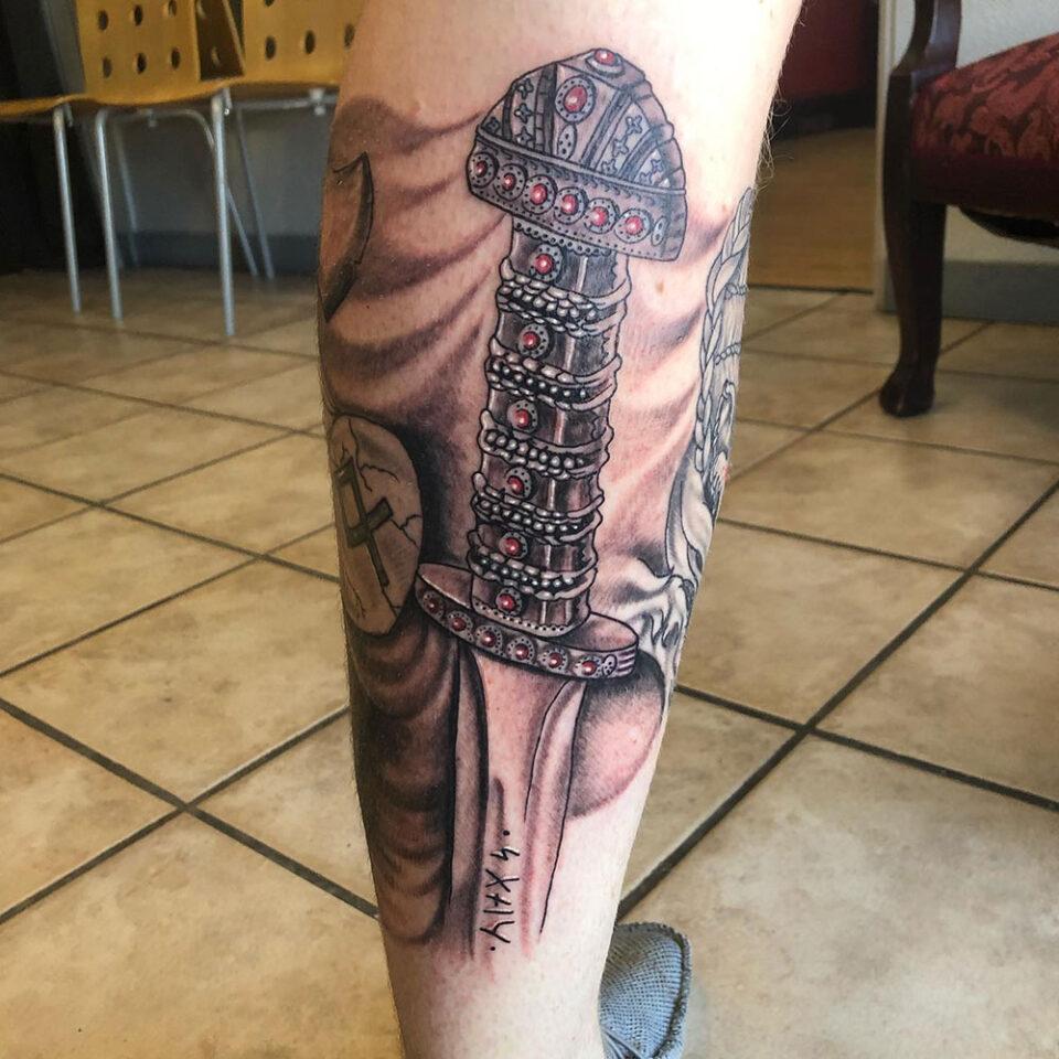 Viking sword tattoo Source @vikingtattooart via Instagram