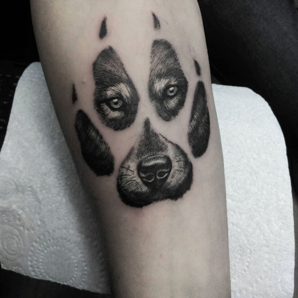 Wolf Paw print Tattoo Source @power.tattoo via Instagram