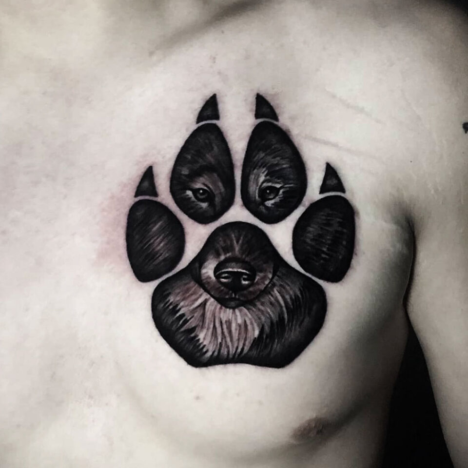 Wolf Paw print Tattoo Source @sacredraventattoo via Instagram