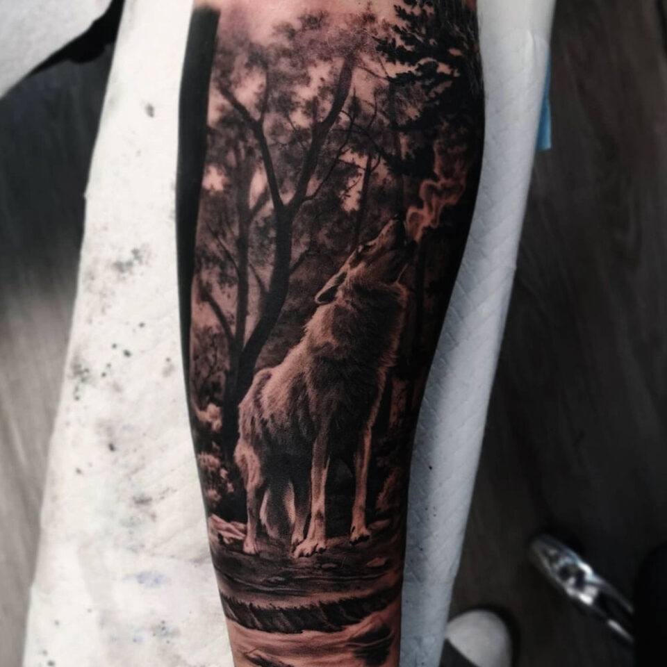 Wolf in the woods Source @cameronroachtattoos via Instagram