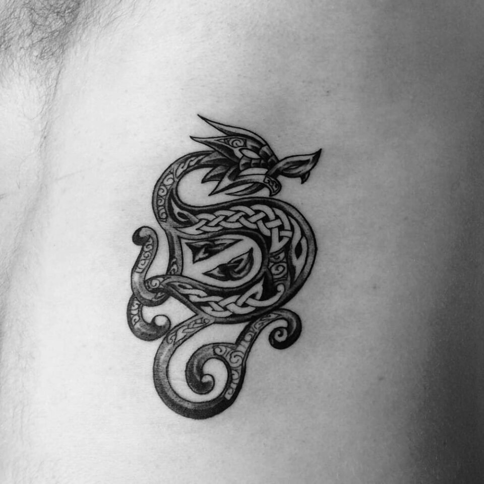 dragon and horseshoe tattoo source via Pinterest
