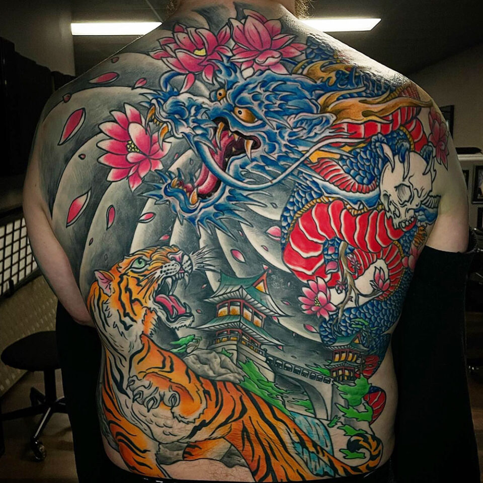 dragon and lotus tattoo source @tattoosbytate via Instagram