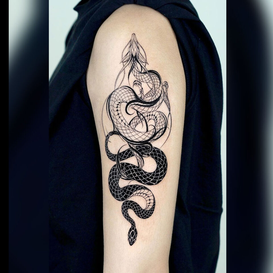 dragon and snake tattoo source @outofstepbooks via Instagram