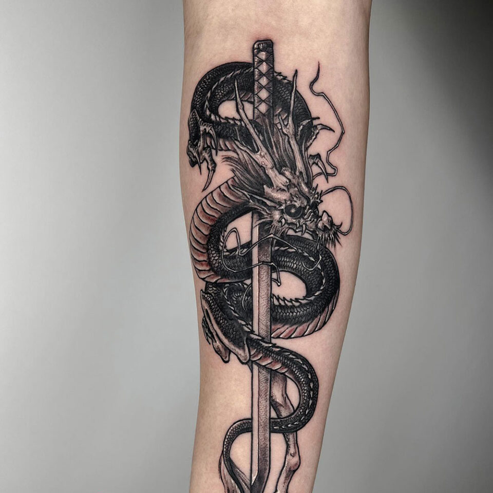 dragon and sword tattoo source dreamhandstattoostudio via Instagram