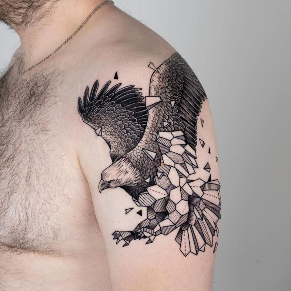 geometric style eagle head tattoo Source @blackhousetattoo via Instagram