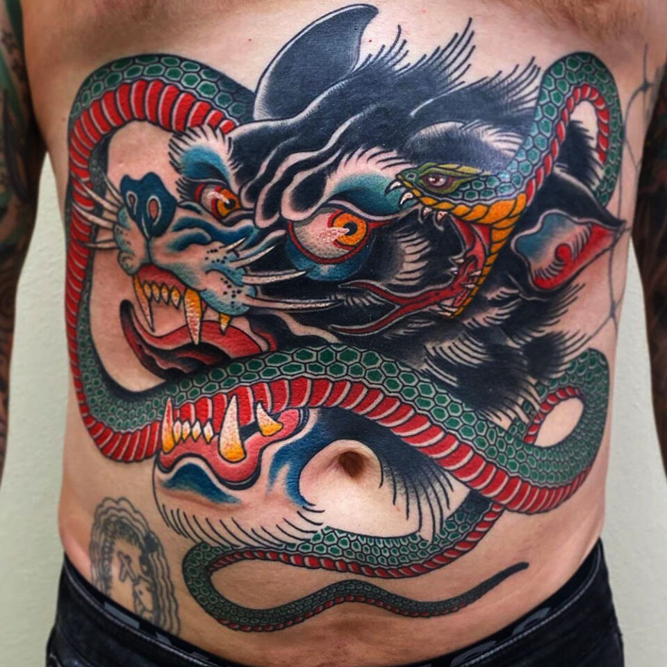 wolf and snake tattoo Source @tattoosnob via Instagram