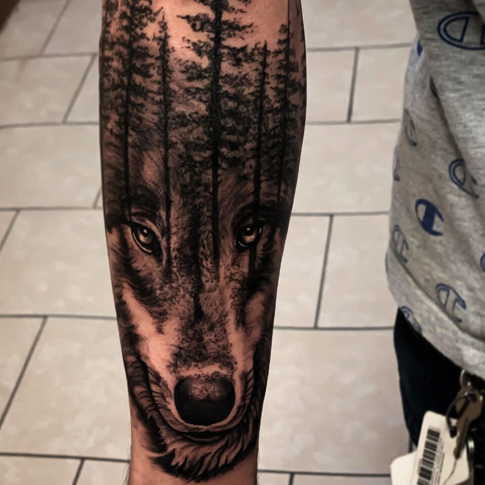 wolf and tree tattoo Source @pelon_tattoos via Instagram