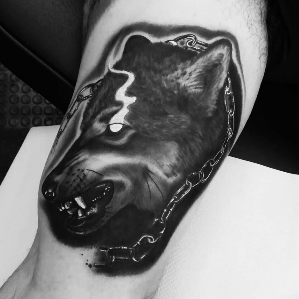 wolf with chain tattoo Source redfalcontattoo via Instagram