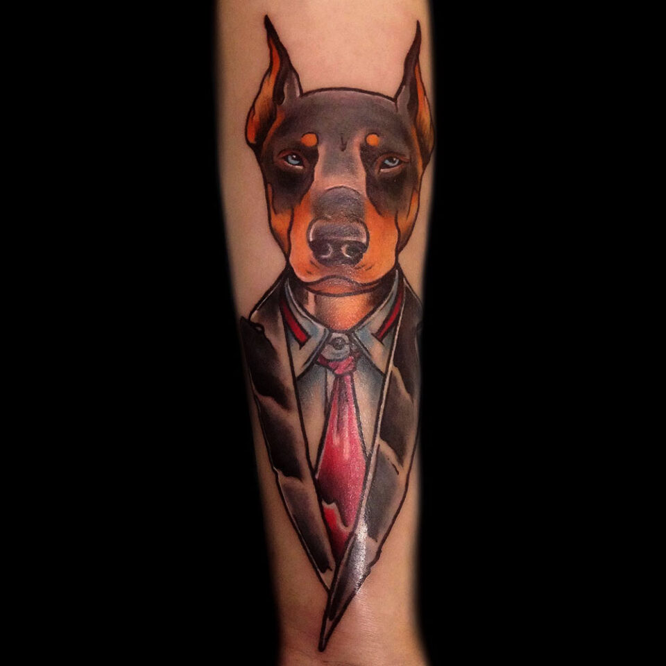 Doberman Pinscher in a Suit Pet Tattoo Source @blackhousetattoo Instagram