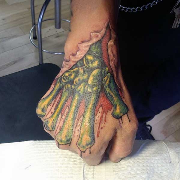 Fist Breaking Through Skin Realism Tattoo Source nextluxury.com
