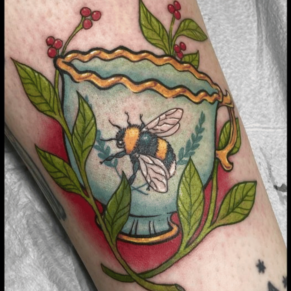 Teacup Bee Tattoo Source_ Rowan Rhys Tattoo via Facebook