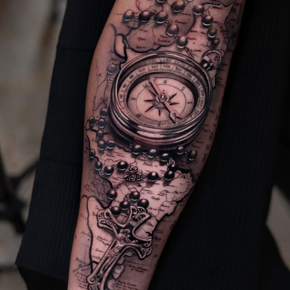ancient map with compass tattoo Source @chematattoo via Instagram