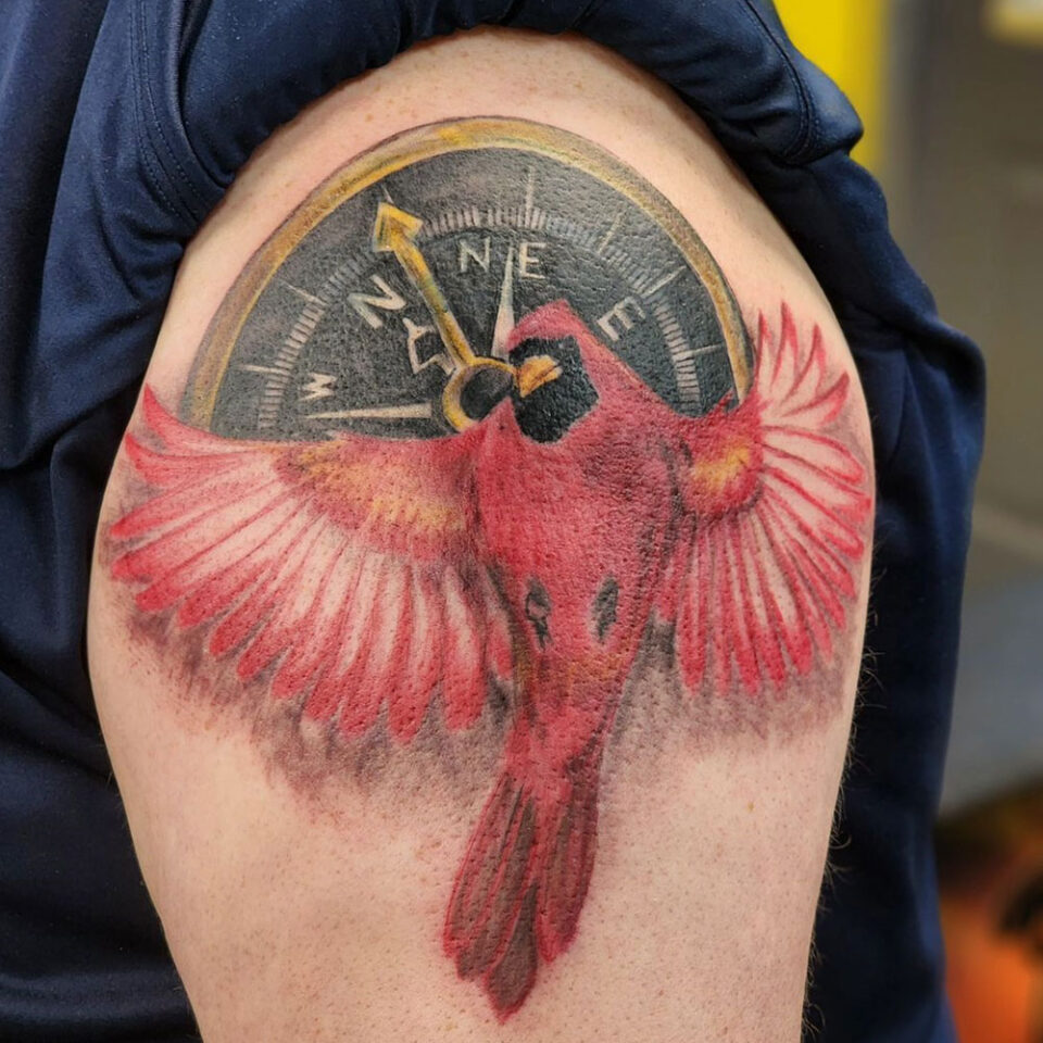 compass with bird in flight tattoo Source @lowbrowtattoocompany via Instagram