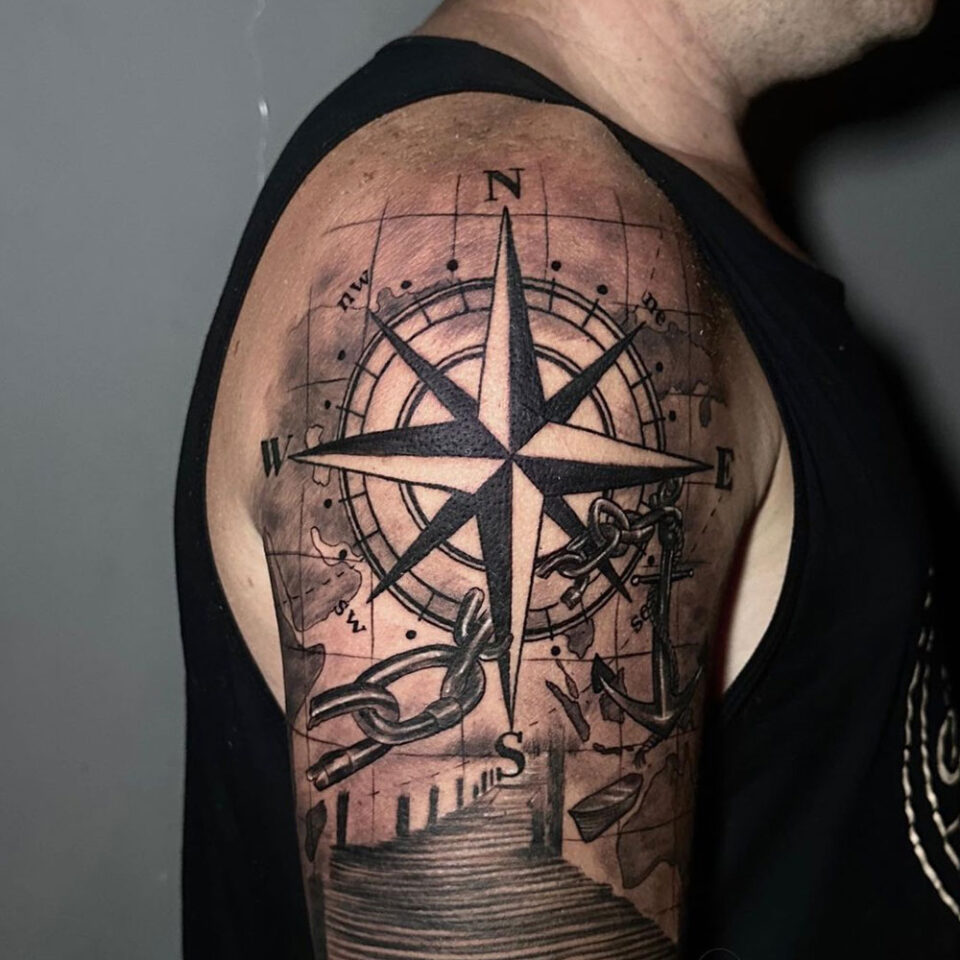 compass with broken chains tattoo Source @anggi.hamzyah via Instagram