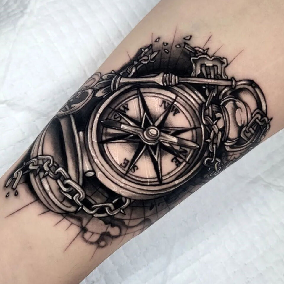 compass with broken chains tattoo Source @roxyart_design via Instagram