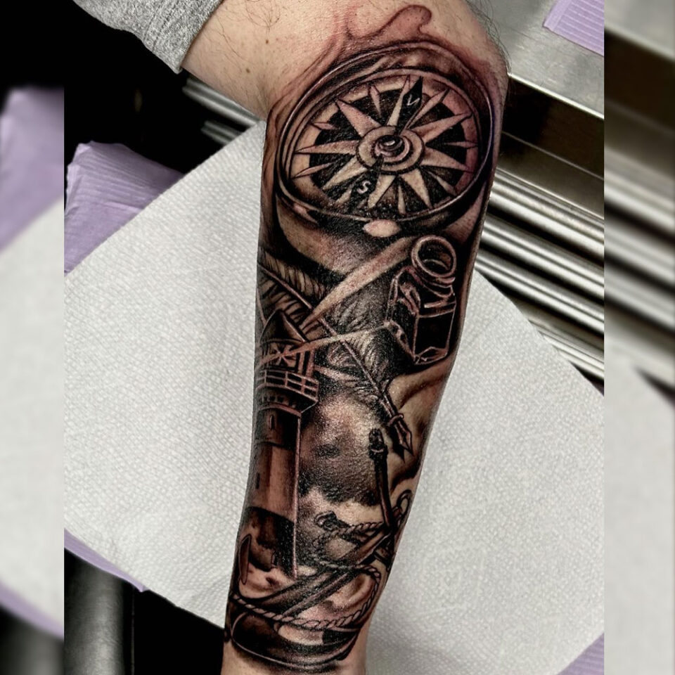 compass with quill tattoo Source @eric_martinello via Instagram
