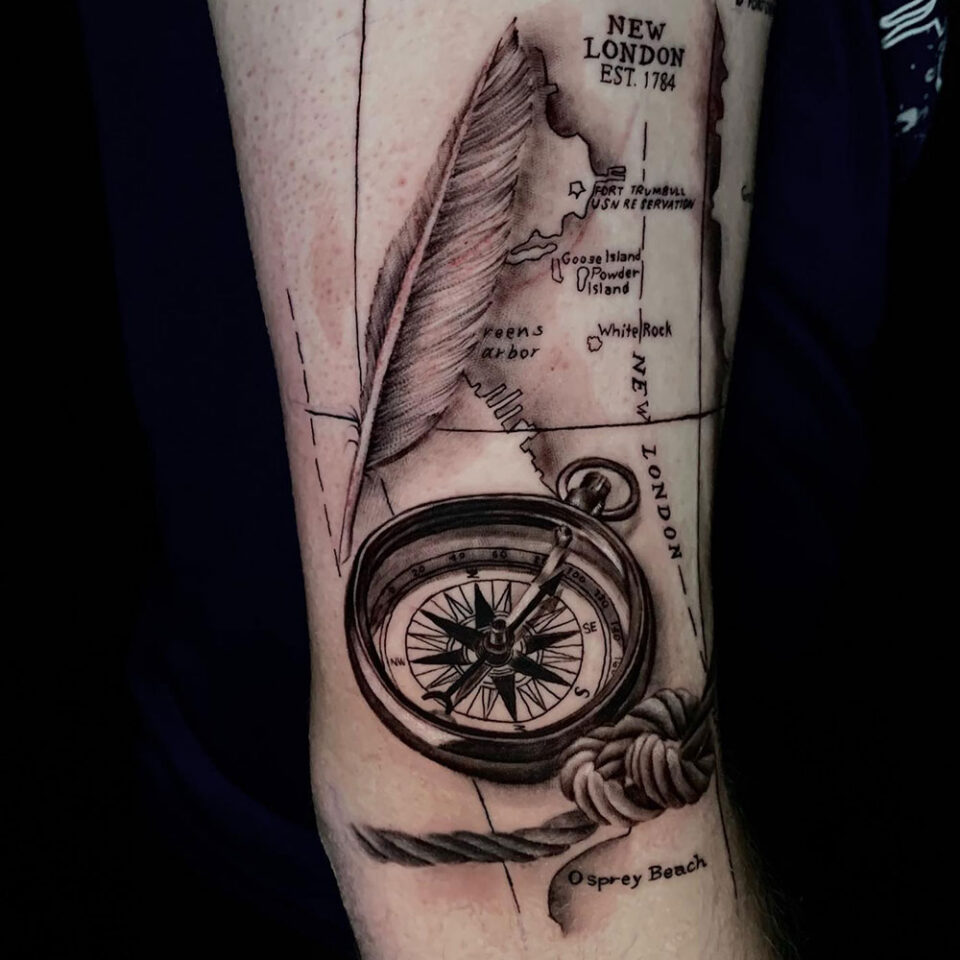 compass with quill tattoo Source @lizabtattoos via Instagram