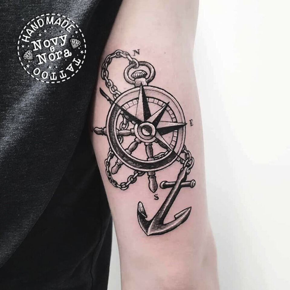 ship wheel and compass tattoo Source @novytattoo_handmade_studio via Instagram