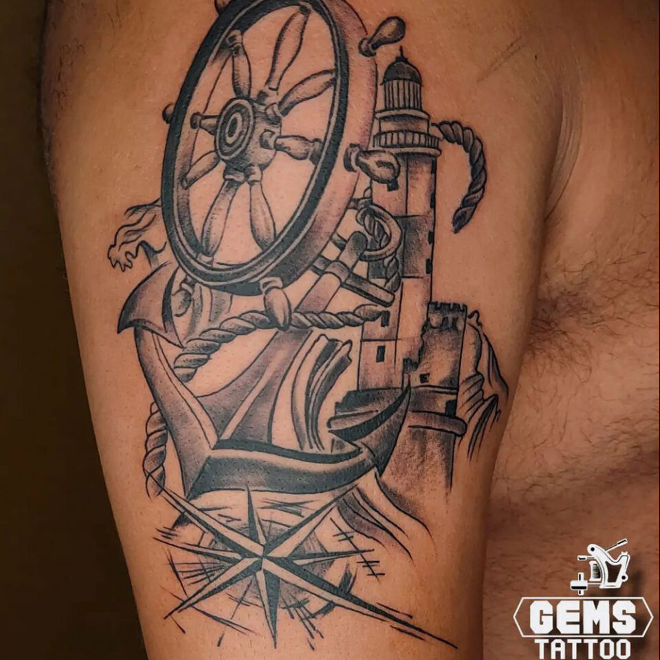 ship wheel and compass tattoo Source @gems_tattoo_studio via Instagram