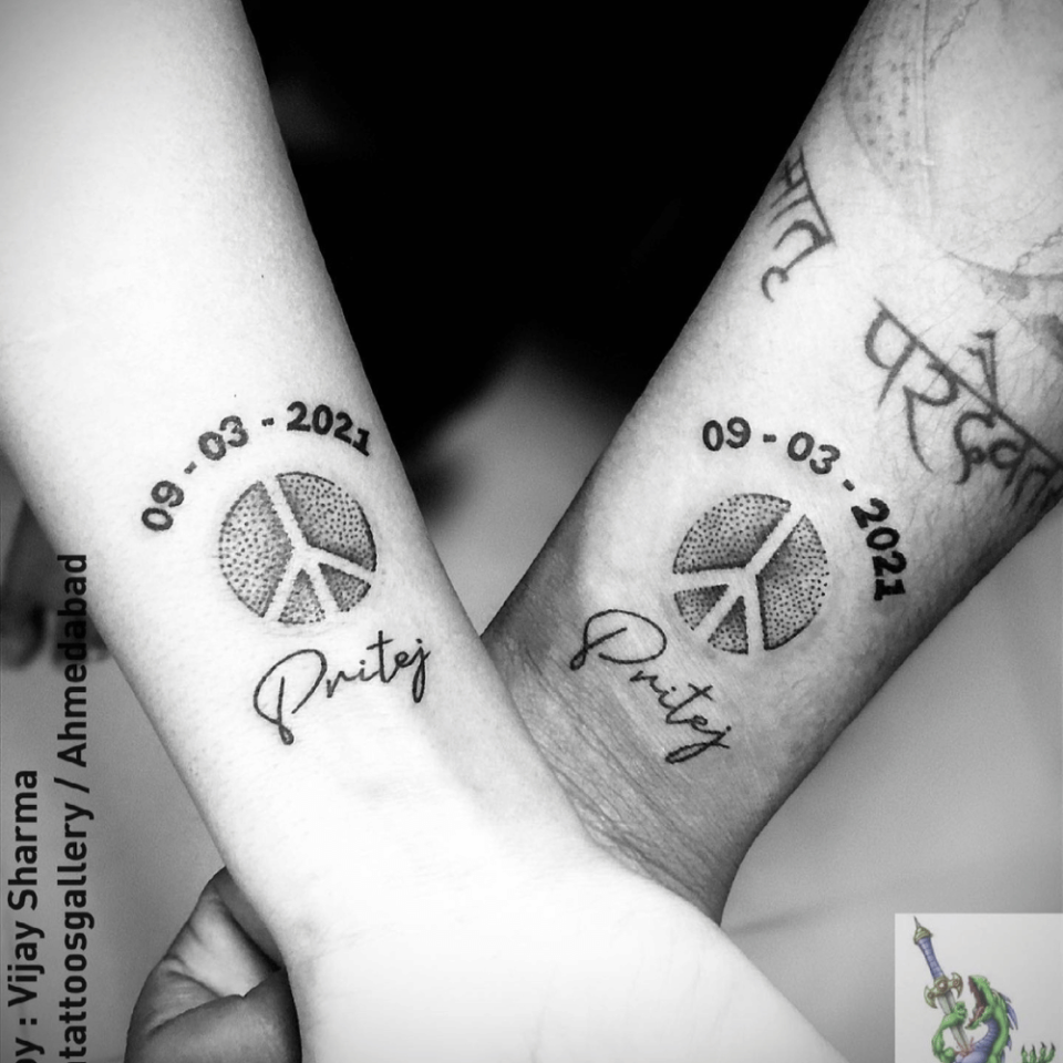 Peace Symbol Matching Tattoo Source @mamix470k via Instagram